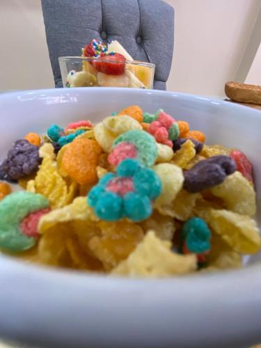 a bowl filled with cereal and fruit loops at Hotel Madrigal in Portoviejo