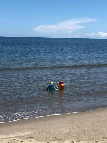 two children playing in the water at the beach at Jamadis in Tolú