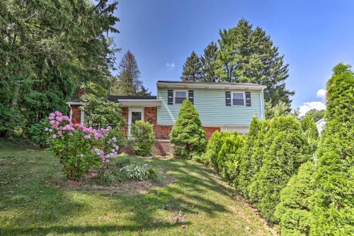 a house with a garden in front of it at Family-Friendly Allentown Abode with Backyard! in Allentown