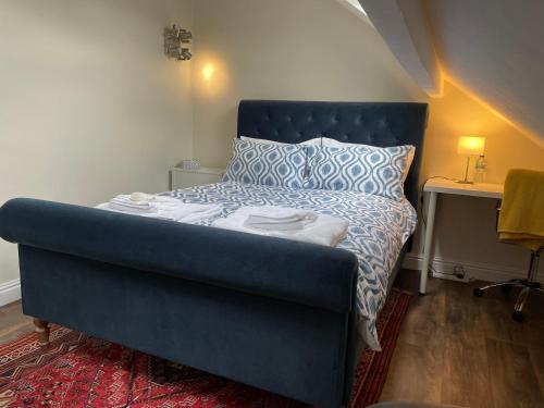 Ένα ή περισσότερα κρεβάτια σε δωμάτιο στο Stonefall Home Stay
