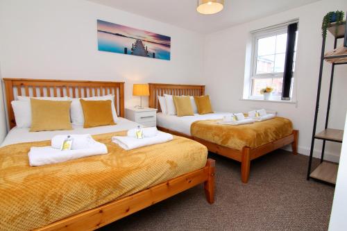 Ένα ή περισσότερα κρεβάτια σε δωμάτιο στο 7Bed City Gem - Walk to Coventry Center, Ultimate Holiday Comfort