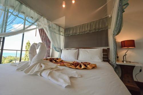 Giường trong phòng chung tại BANGPOR NICE SEAVIEW VILLA