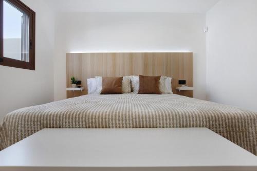 Un pat sau paturi într-o cameră la Crepusculo