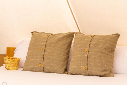 En eller flere senge i et værelse på Respira Glamping Montseny