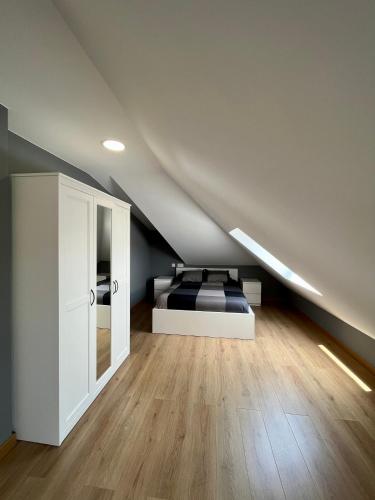 a bedroom with a bed in a attic at Villa Churiana in Camariñas