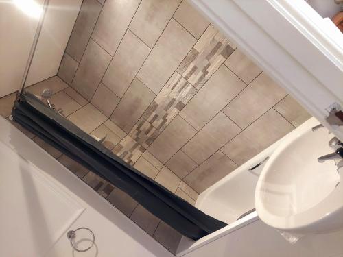 a bathroom with a shower and a sink at The Black Lion Royal Hotel in Lampeter