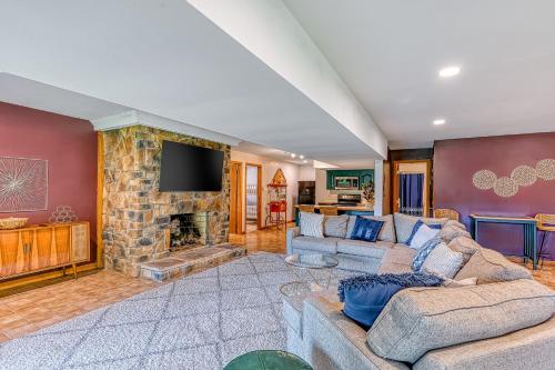 a living room with a couch and a fireplace at The Blue Heron Retreat in Bumpass