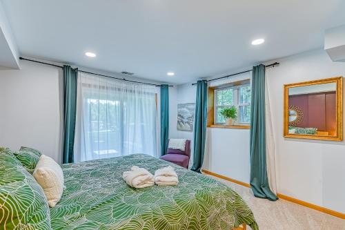 a bedroom with a bed with two towels on it at The Blue Heron Retreat in Bumpass