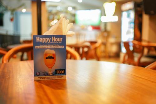 a happy hour juice box sitting on top of a table at Hotel Comster Mtwapa in Mtwapa