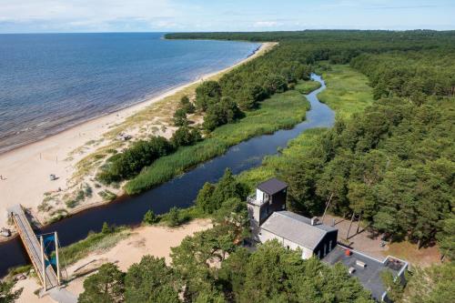 an aerial view of a beach with a house and a river at Jõesuu Guesthouse in Vääna-Jõesuu