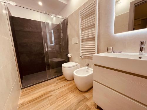 a bathroom with a toilet and a sink and a shower at Affittacamere Residenza Montedoro in Norcia