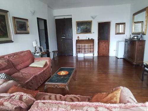 a living room with a couch and a table at ANITA B&B in Uscio