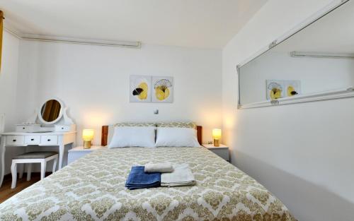 Ένα ή περισσότερα κρεβάτια σε δωμάτιο στο Apartmani Brium