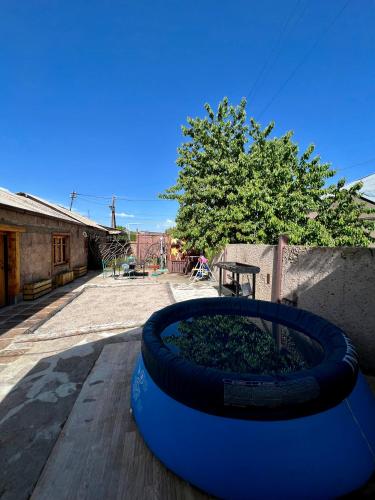 a large blue planter sitting on top of a wooden floor at Apple Tree Family Home (ECO) in Dzorakap