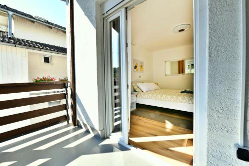 Ένα ή περισσότερα κρεβάτια σε δωμάτιο στο Apartmani Brium