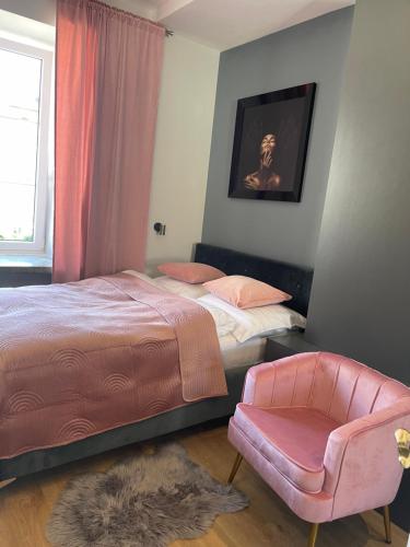 מיטה או מיטות בחדר ב-Apartament na Starówce