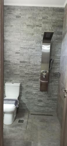 a bathroom with a toilet and a sink at Vot villas in Ormos Panagias