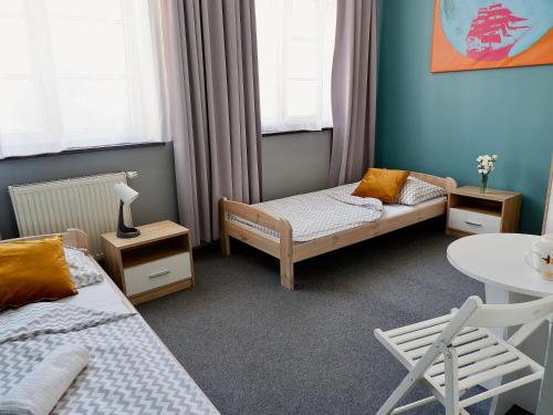 Cama o camas de una habitación en Moon Hostel Gdańsk