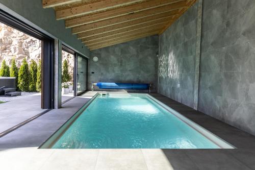 an indoor swimming pool in a house at Dom z basenem Bałtów 22 in Bałtów