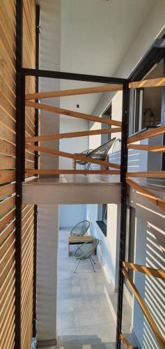 a staircase in a house with wood and glass at Weekend House Solis - Bovec in Bovec