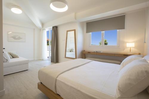Postel nebo postele na pokoji v ubytování THE QUAD Luxury Villas