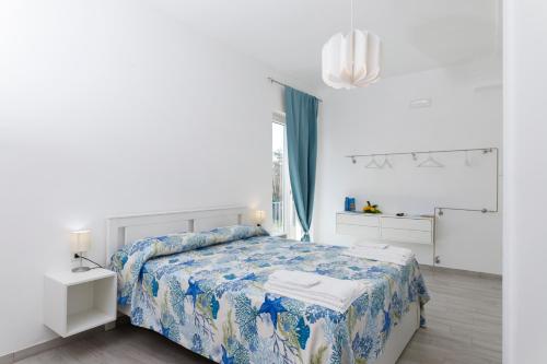 Postel nebo postele na pokoji v ubytování La Casa sul Faro