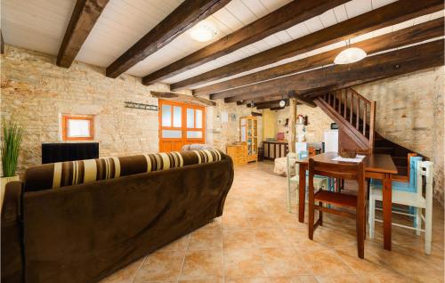 a living room with a couch and a table at Holiday Home Rezanci 05 in Režanci