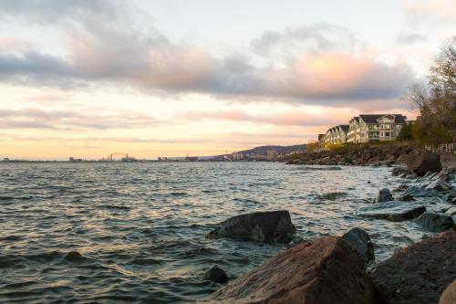 a view of a body of water with rocks at Beacon Pointe on Lake Superior in Duluth