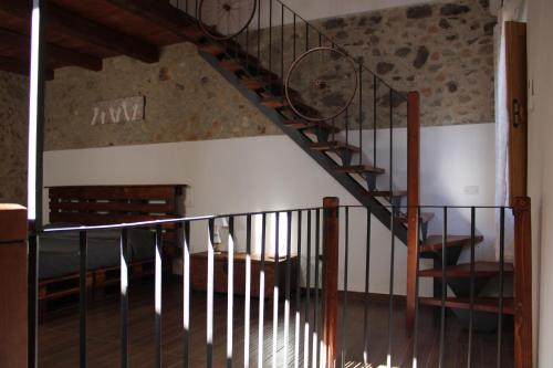 a staircase in a house with a stair case at Ospitalita Diffusa Jungi Mundu - Casa Diritti Umani in Camini