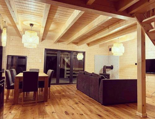 a living room with a couch and a table at Aparthouse Siemiany in Siemiany