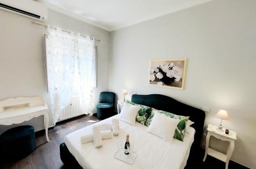 a bedroom with a bed and a table and a chair at BBHOME Saint Paul design boutique Apartment in Rome