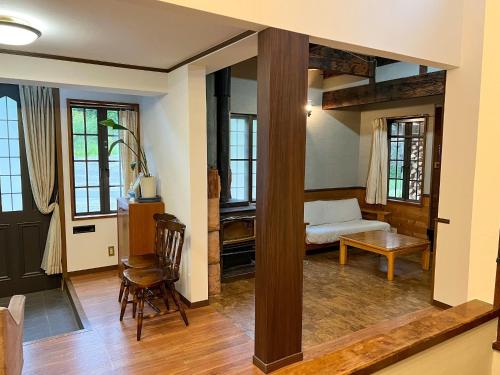 a living room with a bunk bed and a table at Norikura Kogen - irodori - - Vacation STAY 91527v in Matsumoto