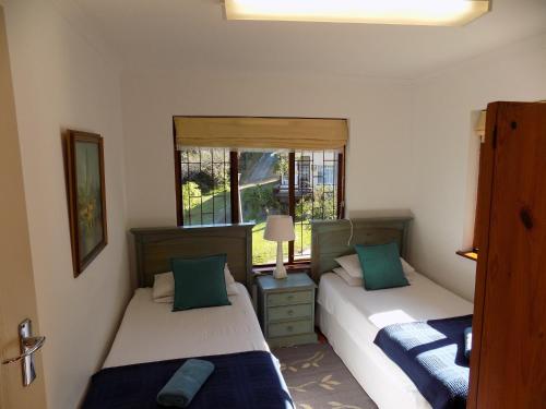 Postel nebo postele na pokoji v ubytování Protea Guest House