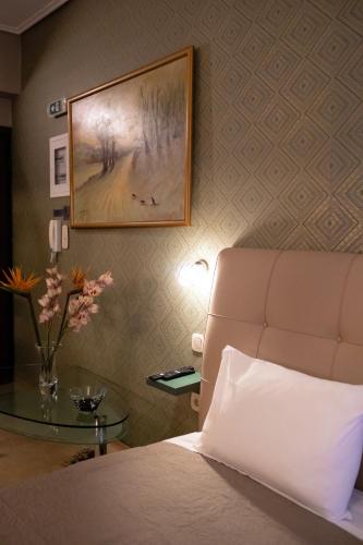 Una cama o camas en una habitación de MARGARITA'S SUITES