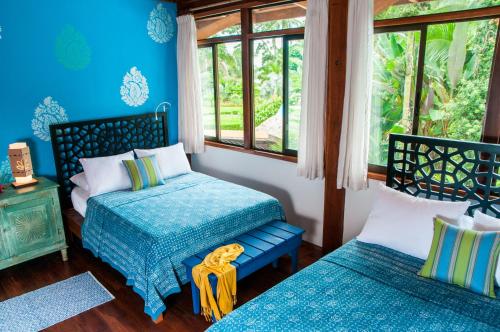 Postel nebo postele na pokoji v ubytování Blue Osa Beach Resort & Spa