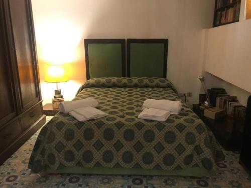 Ένα ή περισσότερα κρεβάτια σε δωμάτιο στο Casa Amedeo