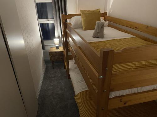 a couple of bunk beds in a room with a window at Two bed holiday home in Conwy in Conwy