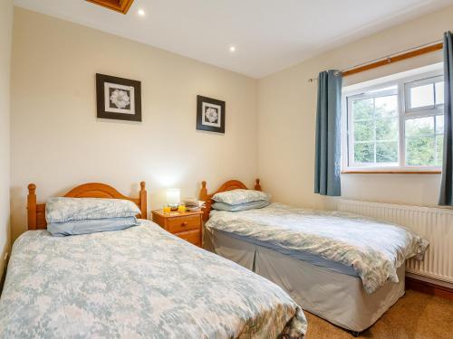 Postel nebo postele na pokoji v ubytování 3 Black Horse Cottages