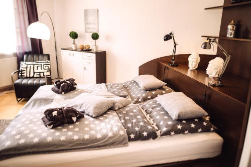 a bedroom with a large bed with pillows on it at Das Hotel Stern, B&B KG - digital & contactless check-in in Sankt Gilgen