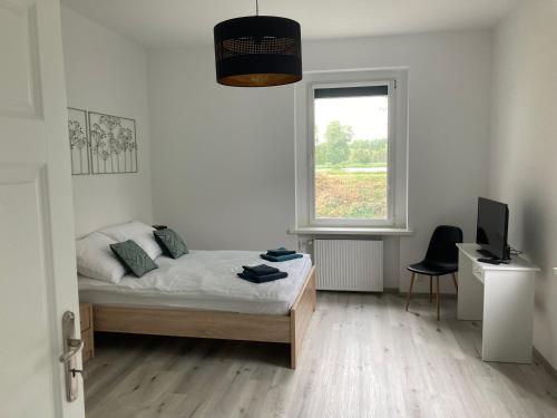Posteľ alebo postele v izbe v ubytovaní Kamienica nad Maltą- Studio przy Malcie