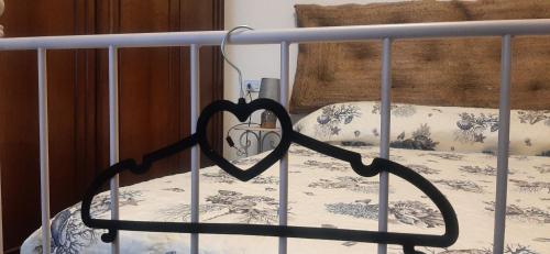 a metal bed with a heart sign on it at CA DU STEA in Lavagna