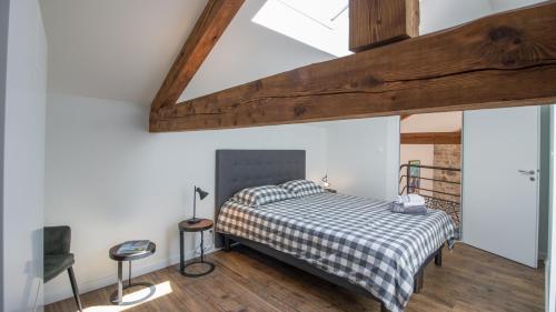 Postel nebo postele na pokoji v ubytování Maison de la Besse