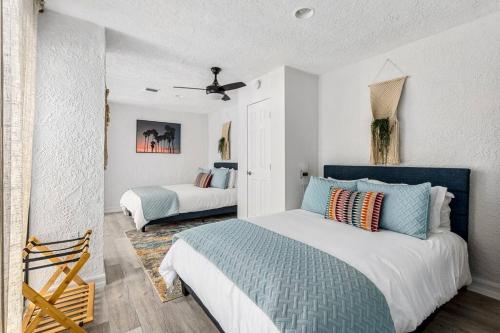 a bedroom with two beds in a room at Poolside Palm Springs Paradise in Palm Springs