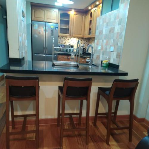Una cocina o zona de cocina en Hospedaje Las Lilas Surco