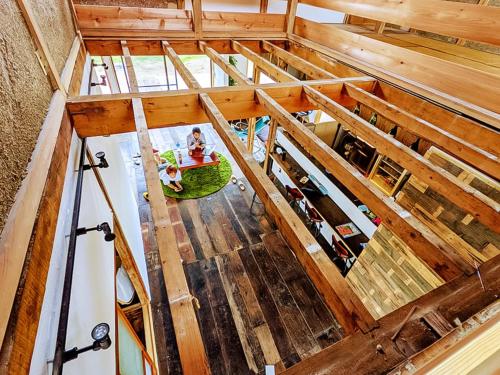 an overhead view of an attic with wooden beams at Guest House Inawashiro~Hanbog~ in Inawashiro
