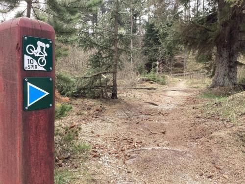 a red post with a no bike sign on a trail at 10 person holiday home in Fjerritslev-By Traum in Fjerritslev