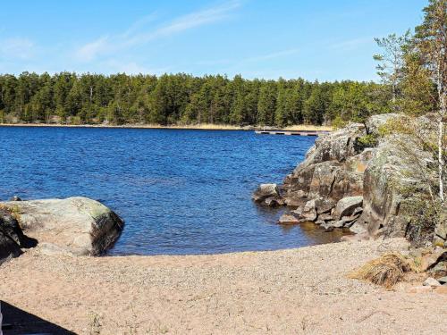 a large body of water with rocks and trees at 6 person holiday home in SÄFFLE-By Traum in Säffle