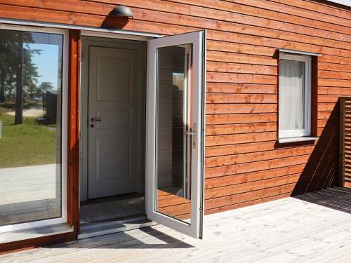 a door on the side of a house at 6 person holiday home in SÄFFLE-By Traum in Säffle