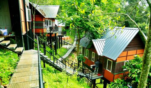 an overhead view of a house with a staircase leading to it at Santhi Hill View Resort in Munnar