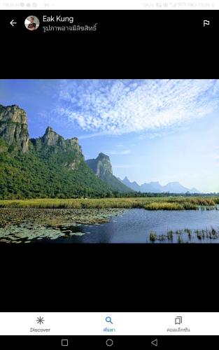 a picture of a river with mountains in the background at Baan Golden Pool Villa in Sam Roi Yot